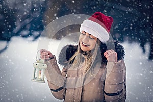 Girl on winter forest with lantern â€“winter holidays, Christmas