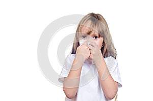 The girl wipes a nose a handkerchief