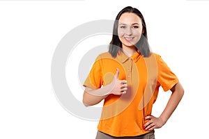 A girl woman in a bright Polo shirt shows a thumbs up gesture and smiles