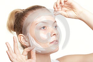 Girl woman in facial peel off mask. Skin care.