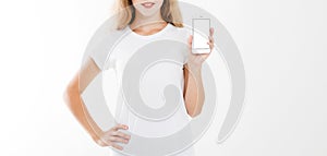 Girl, woman in t-shirt holding blank screen mobile phone isolated on white background. Arm hold smartphone, copy space