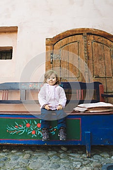 Girl on Wooden Bench