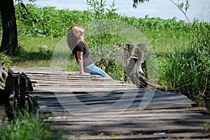 Girl on a wooden bridg