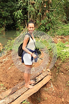 Girl on wooden bridge photo