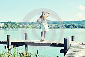 Girl on the wooden jetty
