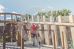 Girl on a wooden Playground in the form of a pirate ship