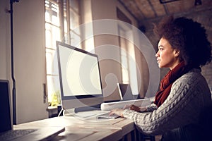 Girl working on computer in office