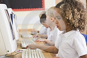 Girl working on a computer at primary school