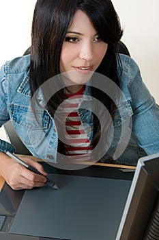 Girl working on a graphic tablet