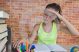 Girl working on his homework. young attractive student Girl studying lessons