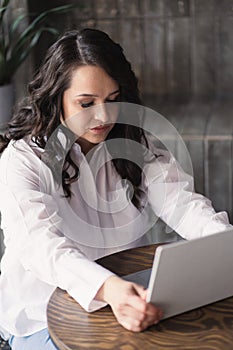 Girl working on laptop from home or student studying from home or freelancer. Online work, early in the morning desk