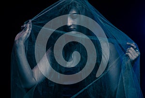 Girl wrapped in dark blue gauze Ghost. The theme for Halloween