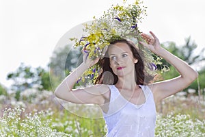 Girl in a wreath of field-flowers