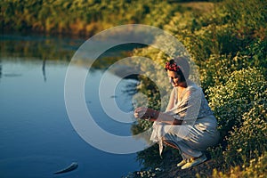 Girl with a wreath in river