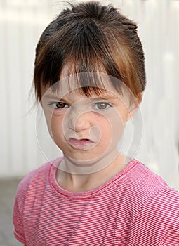 Girl wrinkles her nose