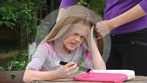 Girl writhing in pain while my mother combing her long tangled hair