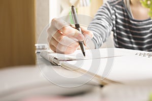 Girl writing in copybook