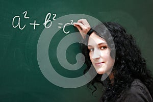 Girl writing formula