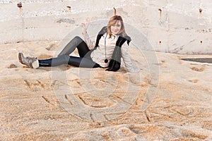 Girl Writing New Year in Sand