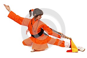 The girl wushu in orange costume in low guard photo
