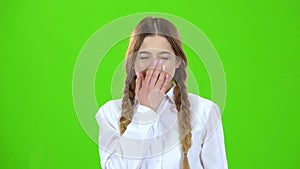 Girl yawns now . Green screen