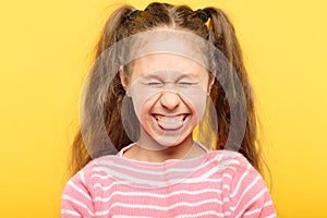 Girl sticking tongue out laughing antics frolicking photo