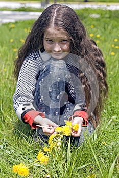 Girl and yellow dandelions