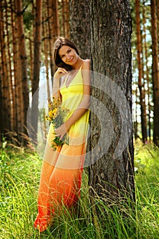 Girl in yellow dress and elecampane