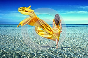 Girl in a yellow dress in sea