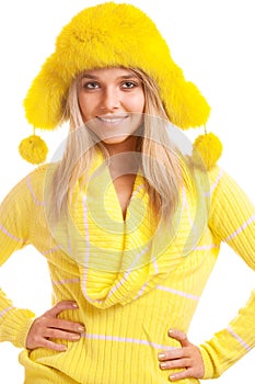 Girl in yellow fur cap and sweater