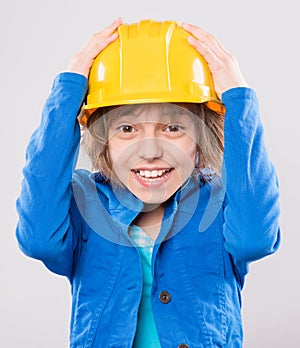 Girl with yellow hard hat