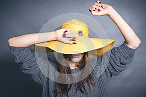 Girl in yellow hat