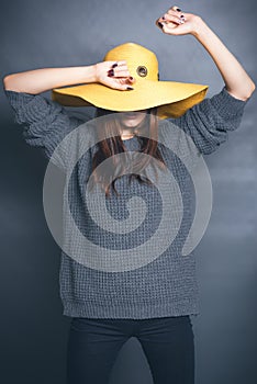 Girl in yellow hat