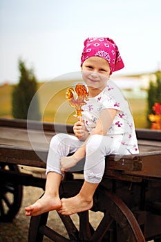 Girl with yellow lollipop