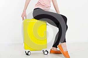 Girl with yellow suitcase isolated on white background .Summer holidays. Travel valise or bag. Mock up. Copy space. Template. Blan