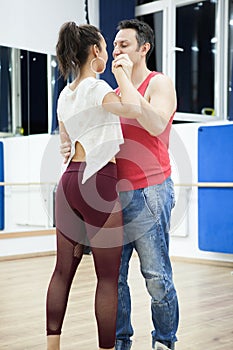 Girl in yoga pants dancing kizomba photo