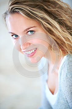 A girl youd take home to mom. Closeup portrait of a pretty young blonde smiling at you sweetly.