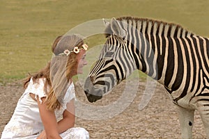 Girl and zebra close together