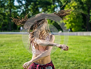 Girl with zizi cornrows dreadlocks dancing on lawn