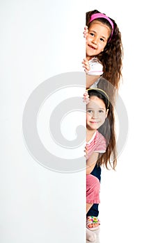 Girles beside a white blank