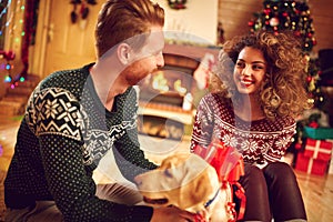 Girlfriend with boyfriend and dog as Christmas gift