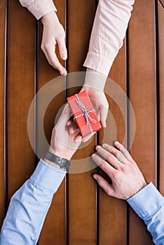 Girlfriend gifting present box to boyfriend