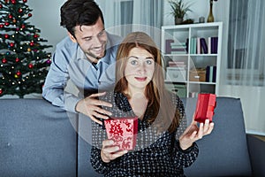 Girlfriend looks sceptical to her christmas gift photo