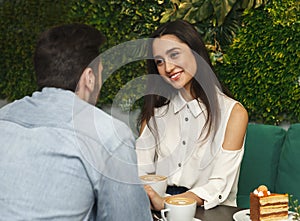 Girlfriend Smiling Flirting With Boyfriend On Romantic Date In Cafe