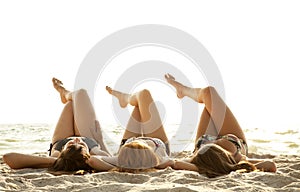 Girlfriends in bikini on the beach photo