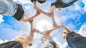 The girlfriends join the wrists in the center making a circle shape.