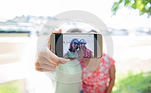 Girlfriends taking selfie together having fun outdoors concept of modern women friendship lifestyle female best friends happy