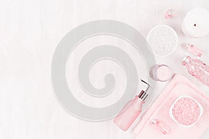 Girlish cute cosmetic products for bath on light white wood board, top view, copy space.