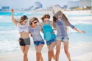 Girls amid a tropical beach.