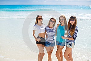 Girls amid a tropical beach.